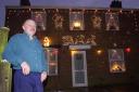 Richard outside his festive decorated home in Mile Cross