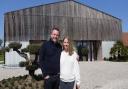 Luke and Klara Hawes outside their 'grain store' home which they have converted into luxury on a futuristic design.