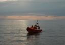 Lifeboat volunteers came to the aid of three people cut off by the rising tide at Brancaster.