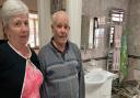 Gail and Ray Westfield, 70 and 73, in front of their damaged bathroom after a car crashed into their home on Harvey Drive, North Walsham, on May 30, 2021.