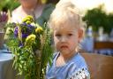 Zlata with the bouquet of flowers her elder sister made for her