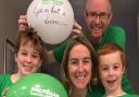 Chris Wright (42) with sons Patrick (nine) and Ben (seven), and wife Rebecca (41), getting to the 1,000km mark in their rowing challenge for MacMillan Cancer Support challenge