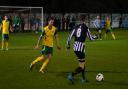 Dereham Town, black and white, in Norfolk Senior Cup action against Spixworth. Picture: JOE SAYER/NORFOLK FA