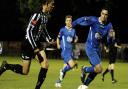 Dereham's Rhys Logan, left, was the star of his side's 2-0 derby win at Wroxham last month. Picture: MARK BULLIMORE