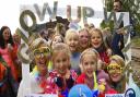 Coltishall Primary School children, staff and parents ready to start their Glow-up Walk along the Bure Valley Railway path to raise funds for Cancer Research, with deputy head Sara Ward, front left.