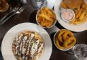 The chicken shawarma, sides and sea bass burger at Yellows Bar and Grill in Norwich.