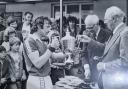 Barry Bullen (centre) collecting a trophy for his sporting achievements