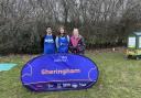 Keith (left) and Nicky (right) Phillips from West Runton gave Alice Connelly a bed and a meal as she reached Norfolk in her charity walk of the entire UK coastline