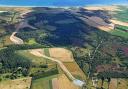 A view of the Horsea Three trench being dug, showing Kelling Heath, the village of Weybourne beyond it, and the north Norfolk coast