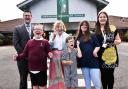 Sheringham Woodfields School business manager Matthew Smith MBE (left), with Lady Dannant MBE, the Lord Lieutenant of Norfolk (centre), headteacher Annette Maconochie (right) and children of the school