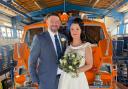 Lifeboat volunteers Neil Davies and Monika Lewandowska married in Norwich before stopping at the Cromer RNLI end of pier station for pictures on the way to their reception