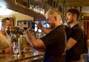 Pints being poured in the main bar area at The Suffield Arms