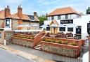 The White Horse in East Runton has revealed who is turning on its Christmas lights