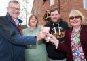 Claire and Robert Shearing (centre) receive the keys to their new home from Michael Newey, chief executive of Broadland Housing (left), and Cllr Wendy Fredericks, deputy leader of North Norfolk District Council.