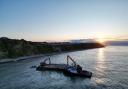 Rocks for the defences being barged in