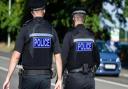 A man has been arrested after a police car and an office building were damaged in north Norfolk