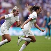 Lauren Hemp celebrates with Ella Toone, who opened the scoring for England