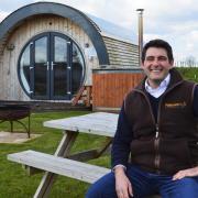 Luke Paterson of Dilham Hall with one of the glamping pods at Tonnage Bridge