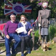 Maureen and Thomas Jarvis with their winning scarecrow, from a Platinum Jubilee-themed scarecrow contest in East and West Runton