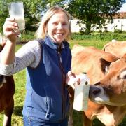 Rebecca Mayhew with some of her dairy cows at Old Hall Farm in Woodton