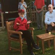 Former councillor Marie Strong and husband Mike were presented with some garden furniture at a surprise presentation at Langham Dome.