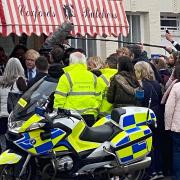 Sir Kenneth Branagh, filming a scene for the political drama This Sceptred Isle, in character as prime minister Boris Johnson coming out of Coxford's Butchers in Aylsham's Market Place.