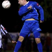 Danny Beaumont heads the ball for Wroxham during a match against Wroxham. Picture: MARK BULLIMORE