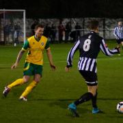 Dereham Town, black and white, in Norfolk Senior Cup action against Spixworth. Picture: JOE SAYER/NORFOLK FA