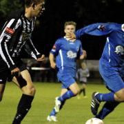 Dereham's Rhys Logan, left, was the star of his side's 2-0 derby win at Wroxham last month. Picture: MARK BULLIMORE