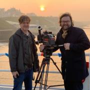 Cameraman Bernd Fischer, left, and director Jens Meurer during the filming of Seaside Special, a film about the Cromer Pier Show.