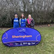 Keith (left) and Nicky (right) Phillips from West Runton gave Alice Connelly a bed and a meal as she reached Norfolk in her charity walk of the entire UK coastline