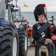 George Sinclair playing the bagpipes outside Sheringham Lifeboat Station