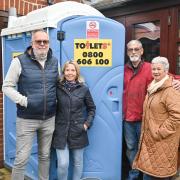 Flood-hit Staithe Road residents Steve and Susan Adkins with their neighbours William and Deanna Wells and their new portable toilet