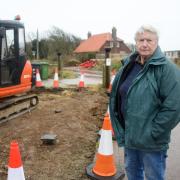 Happisburgh's Bryony Nierop-Reading, known as Granny Canute, has sacrificed another chunk of her garden to the district council to save the village’s clifftop Beach Road car park from being cut-off by erosion