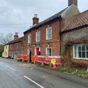 The damaged house in The Street in Thornage