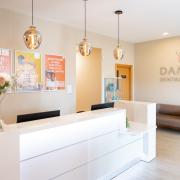 Damira Dental Studios has said it has secured an NHS contract for its practice in Holt .