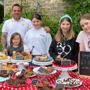 Stuart Lewis, Lila and Chloe Lewis, Erin Harward and Florence Jackson serve up tasty treats