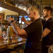 Pints being poured in the main bar area at The Suffield Arms