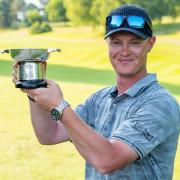 Brad Smith with the English Open for golfers with a disability trophy.