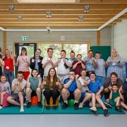 Pupils and staff celebrate their outstanding Ofsted inspection with head teacher, Annette Maconochie.