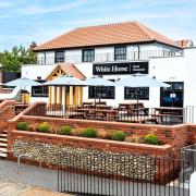 The White Horse in East Runton has revealed who is turning on its Christmas lights