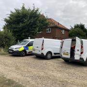 A police forensics team at the scene of the fire