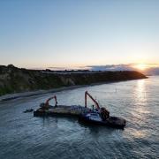 Rocks for the defences being barged in