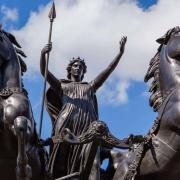 Boadicea, fiery Queen of the Iceni, charges into battle against invading Romans.