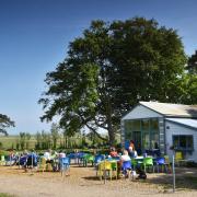 Customers sitting outside the café at Wiveton Hall