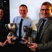 Holt Farmers' Club's double malting barley champion Andrew Ross (centre), with judge Rebecca Gee, grain procurement director for the Crisp Malting Group, and Chris Borrett, of grain merchants Adams & Howling