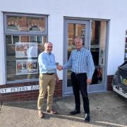 Mark Nolan, managing director of Chaplin Farrant, and Ian Mutton, chairman of SMG Architects, shaking hands outside SMG Architects office in Sheringham