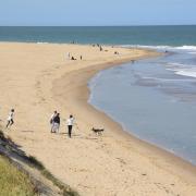 People enjoying the beach at Winterton