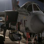 An RAF Tornado sitting on the pan with two Storm Shadows underneath it (Cpl L Matthews/PA)