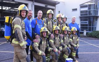 Norfolk firefighters ready to start their 100 miles walk in aid of Norfolk and Waveney Mind, and the Firefighters charity, in full PPE including the breathing apparatus sets